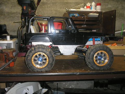 1994 Ford Escort - This modified Jeep Wrangler sits on a workbench, its custom wheels and suspension.