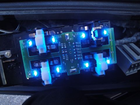 2003 Ford Crown Victoria - Close-up of a circuit board with multiple blue LEDs illuminated and white switches.
