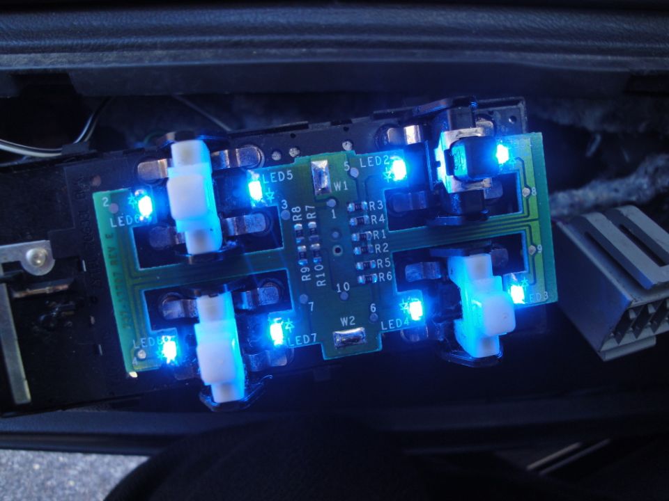 Circuit board with blue LEDs and white switches