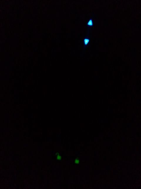 2003 Ford Crown Victoria - Several small LED lights, some blue and some green, are visible against a black background.