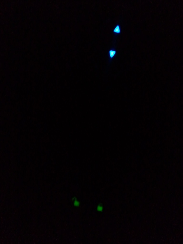 blue and green LED lights glowing in the dark