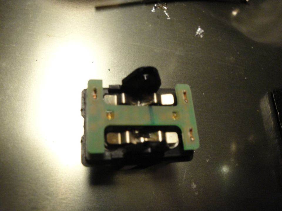 Electrical component with green circuit board and metal contacts