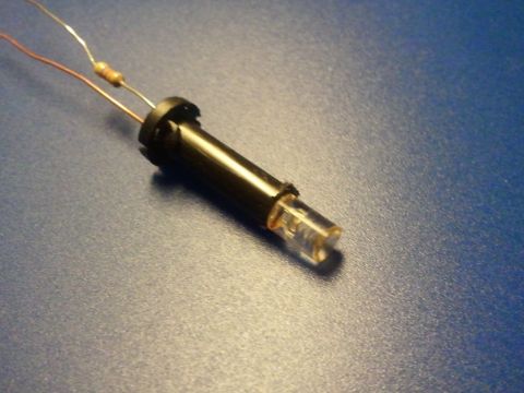 2003 Ford Crown Victoria - Close-up of an electronic component, an LED bulb with attached resistor and wires.
