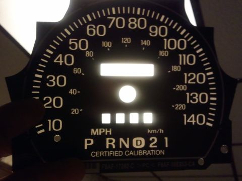 2003 Ford Crown Victoria - Close-up of a vehicle's instrument cluster showing MPH and KM/H readings, with gear selection indicators.