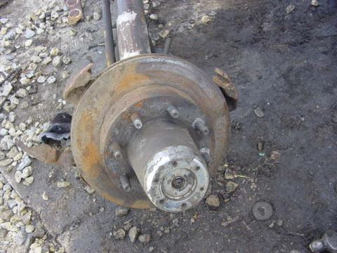 1992 Ford Bronco - remove rotor then hub cap.