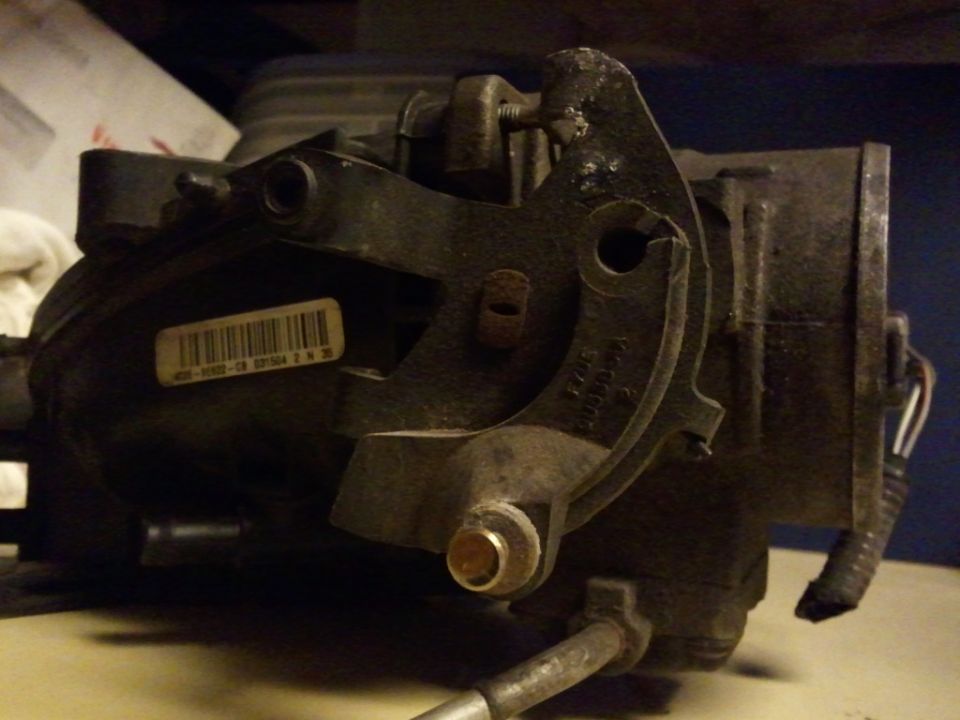Throttle body with a barcode sticker and wiring harness