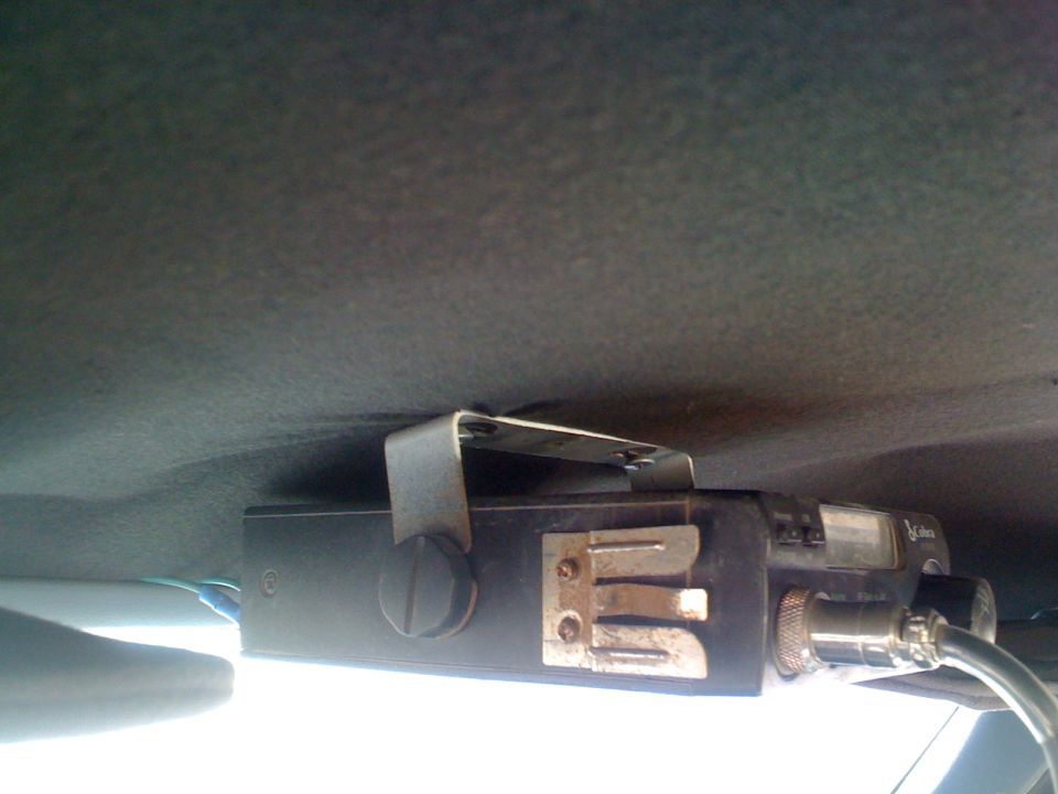 CB radio mounted to the ceiling of a vehicle