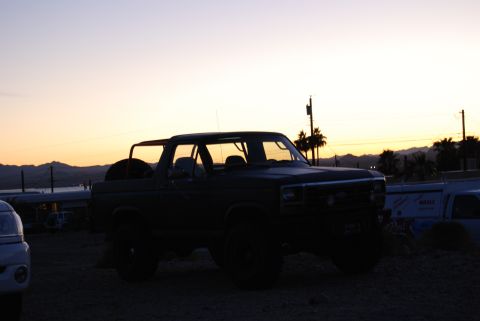 1982 Ford Bronco - This 1982 Ford Bronco, seen in silhouette, features a removable top and is parked outdoors during sunset.