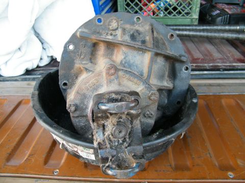 1982 Ford Bronco - A differential third member is shown, possibly for a Ford Bronco, resting in a bucket.