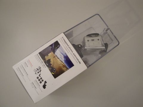 1993 Ford Taurus - A camera is displayed in its retail packaging, showing product details and accessories.