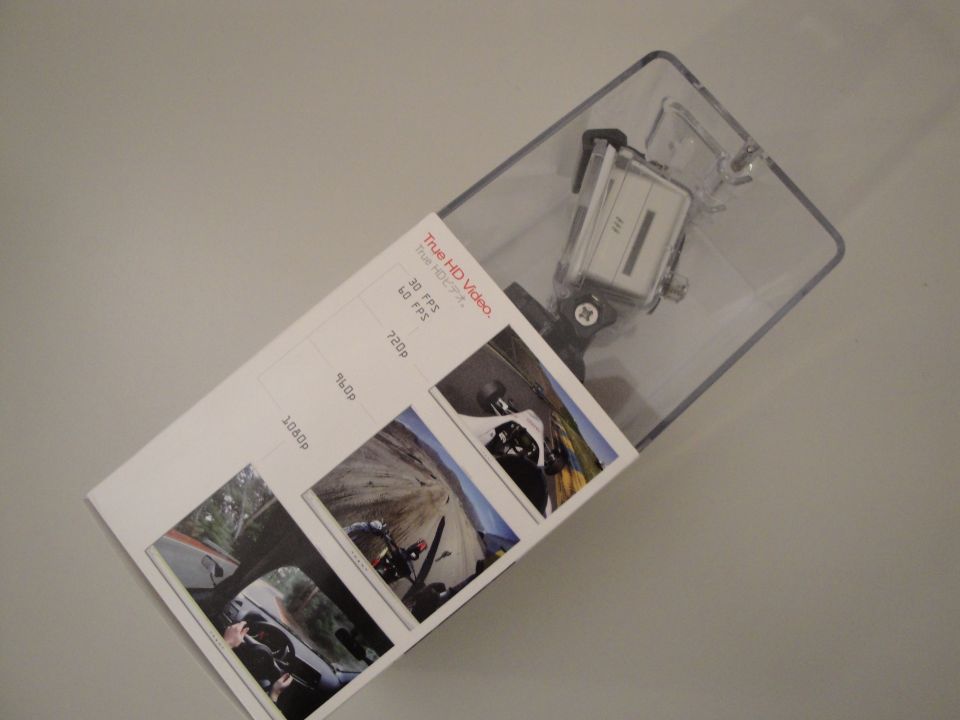 Action camera in clear plastic packaging with product information card