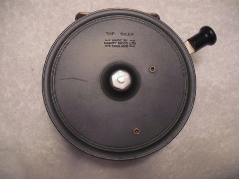 1990 Ford Bronco - A close-up view of a vintage fishing reel, identified as "The Silex" and manufactured by Hardy Bros. Ltd. in England.