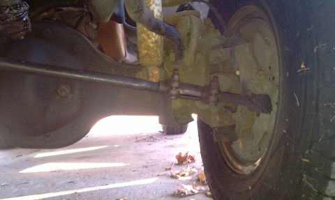 1993 Ford Bronco - This image shows the underside of a vehicle, focusing on the rear axle and suspension system. No specific year or model is identifiable.