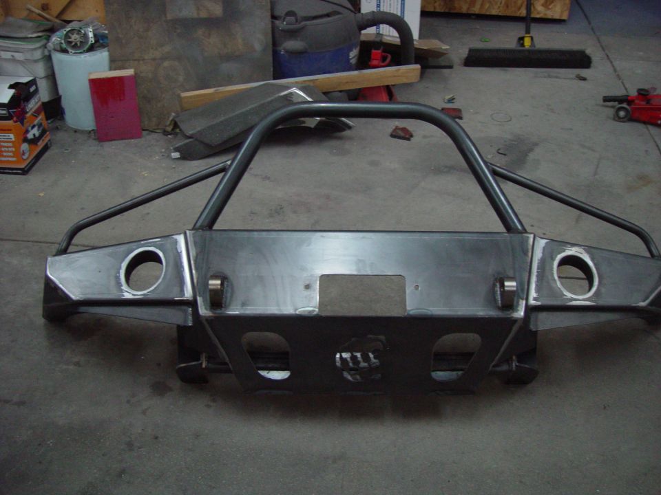 Custom steel bumper with brush guard, ready for installation