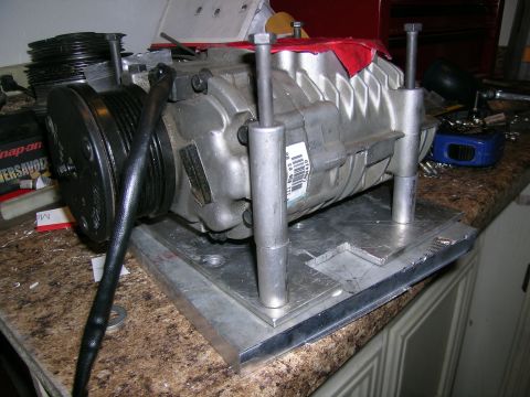 1995 Ford Probe - A supercharger assembly, likely for a custom build, is shown mounted on a metal plate.