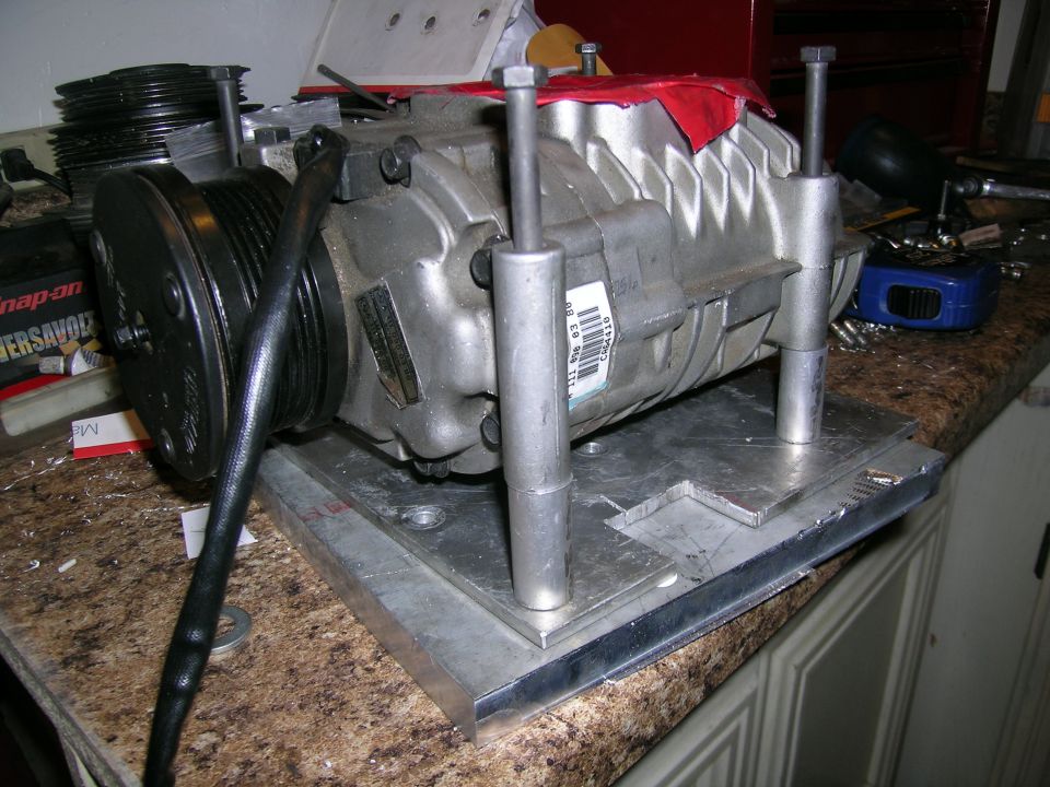 Supercharger assembly with pulley and mounting hardware