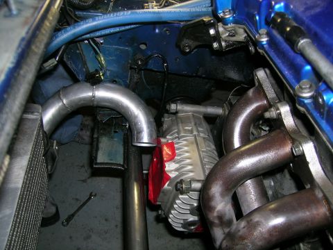 1995 Ford Probe - Custom engine modifications are visible, including a supercharger and exhaust headers.