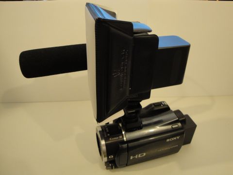 1993 Ford Taurus - A Sony HD camcorder is equipped with a directional microphone and a portable light panel for recording.