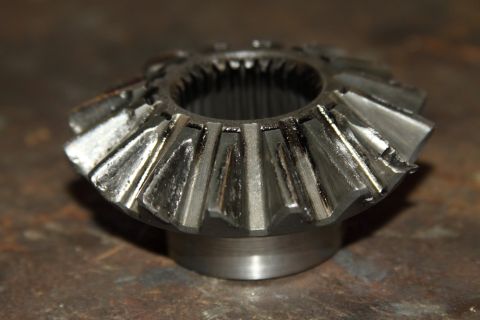 2004 Jeep TJ - Differential spider gear showing signs of wear on its teeth.