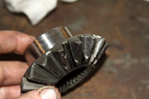 2004 Jeep TJ - A close-up view of a damaged differential gear, indicating mechanical wear and tear.