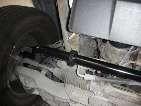 2004 Ford Crown Victoria - Underside view of a vehicle's front suspension system, highlighting a newly installed sway bar.