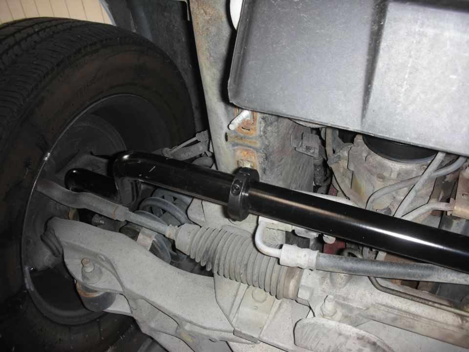 close-up of car's front suspension with sway bar installed