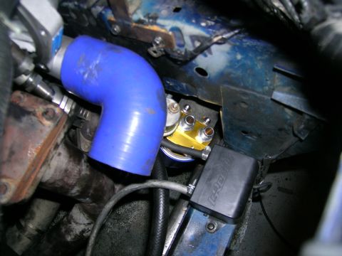 1995 Ford Probe - Custom turbo plumbing and fuel filter assembly with a GReddi component visible.