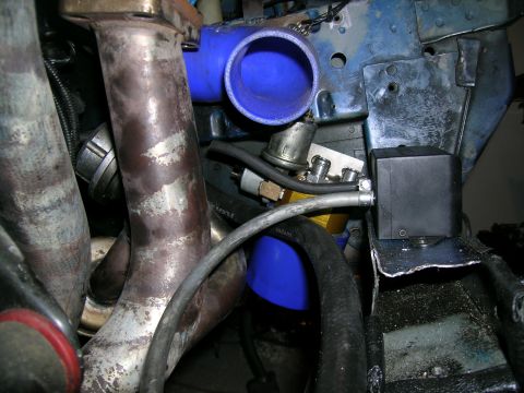 1995 Ford Probe - Close-up view of custom turbocharger plumbing and engine components.
