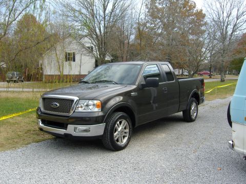 2007 Ford Mustang - This dark gray 2007 Ford F-150 pickup truck is shown from a 3q front angle.