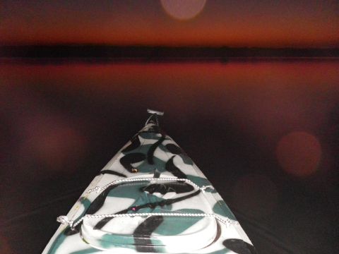 1991 Ford Bronco - Kayak bow with camouflage pattern against a sunset over water. Supermotors.net logo visible.