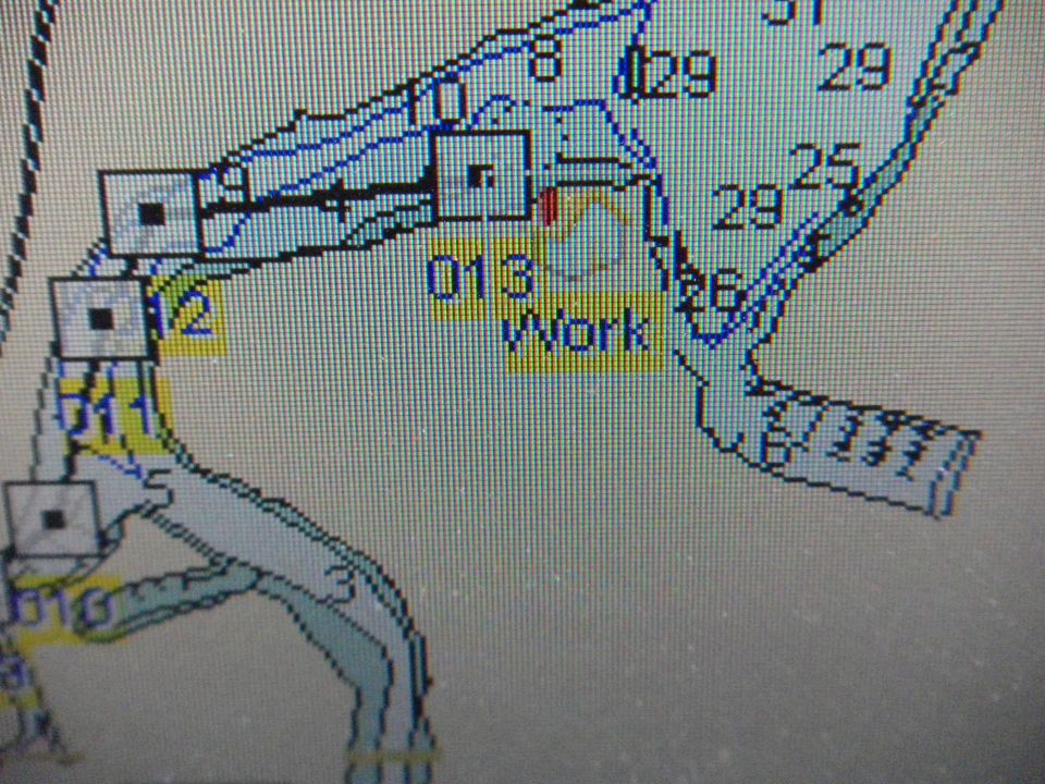Photo of a GPS chartplotter screen with depth contours and waypoints