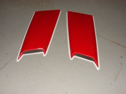 1996 Jeep Grand Cherokee - A pair of red hood scoops with white trim and black mesh inserts are shown on a gray surface.