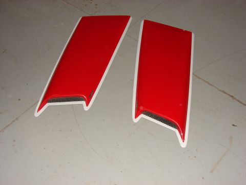 1996 Jeep Grand Cherokee - Two red hood vents with white trim and black mesh inserts are shown on a gray floor.
