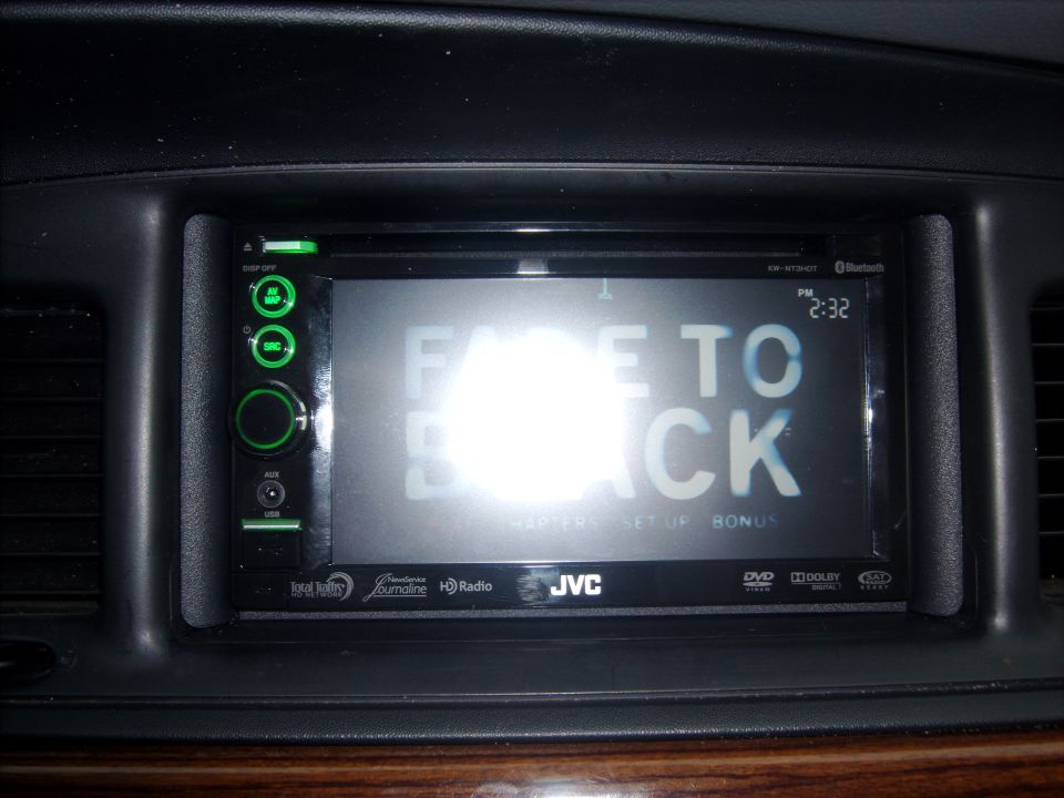 Car stereo screen displaying 'FADE TO BLACK' with time 2:32 PM