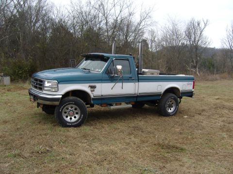 2007 Ford Mustang - This Ford F-250 pickup truck features a two-tone paint scheme and tall exhaust pipes.