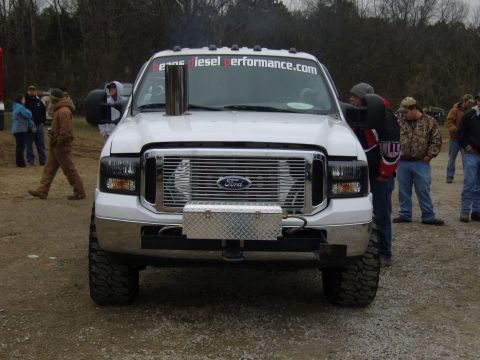 2007 Ford Mustang - A white Ford truck with a prominent exhaust stack and "beansdieselperformance.com" visible on the windshield.