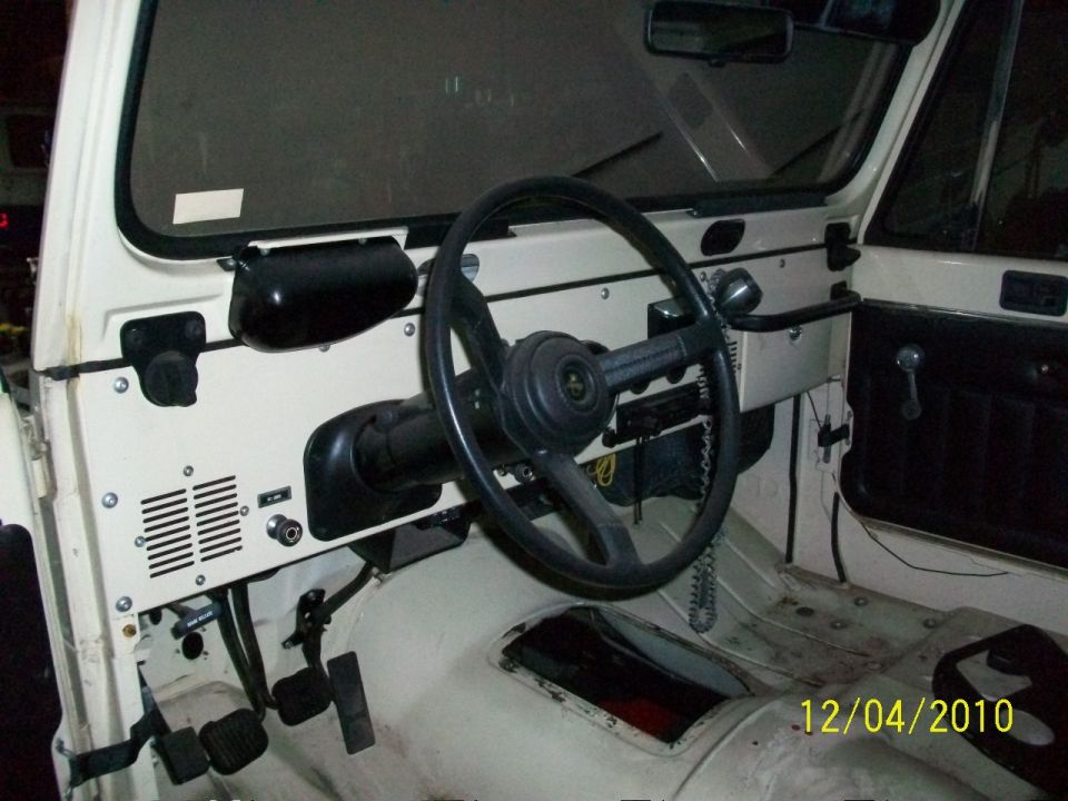Interior of a 1986 Jeep Wagoneer showing dashboard and steering wheel