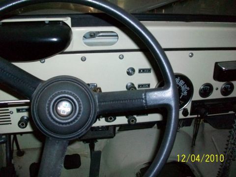 1986 Jeep Wagoneer - Dashboard view of a 1986 Jeep Wagoneer, including steering wheel and instrument cluster.