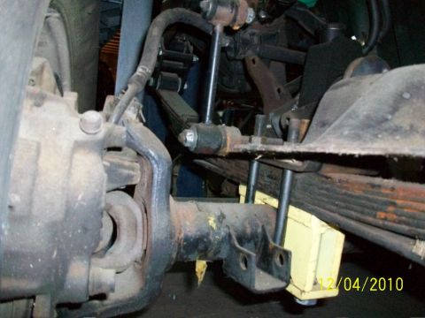 1986 Jeep Wagoneer - Front suspension components including leaf springs and axle housing are visible in this close-up shot.