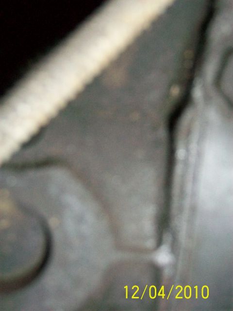 1986 Jeep Wagoneer - A close-up view of an engine block, showing some wear and a timestamp of 12/04/2010.