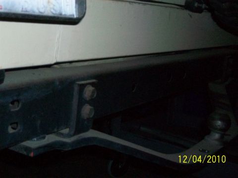 1986 Jeep Wagoneer - Close-up view of a vehicle's rear bumper and trailer hitch assembly, with a date stamp visible.
