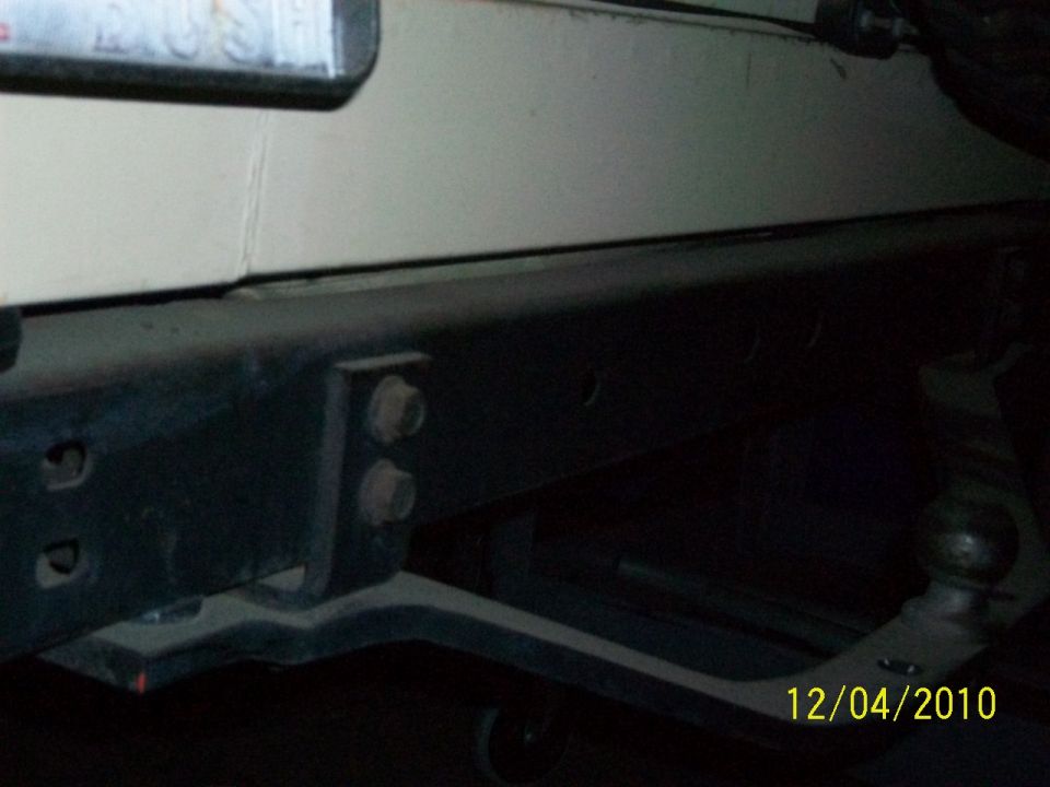 Rear bumper and trailer hitch on a vehicle