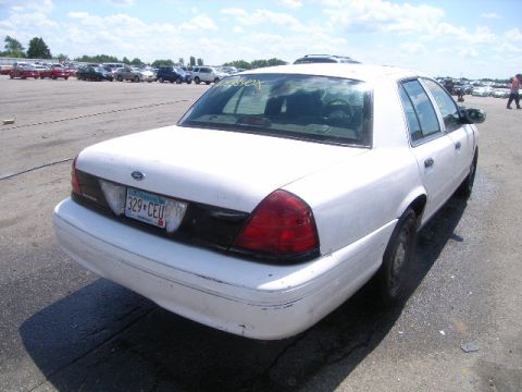 2003 Ford Crown Victoria - This 2003 Ford Crown Victoria is seen from the rear in a parking lot.