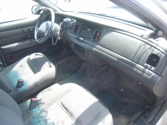 2003 Ford Crown Victoria interior showing dashboard, steering wheel, and front seats