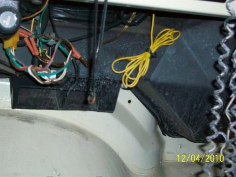 1986 Jeep Wagoneer - A close-up view of a vehicle's interior wiring harness shows a complex network of wires and connectors.
