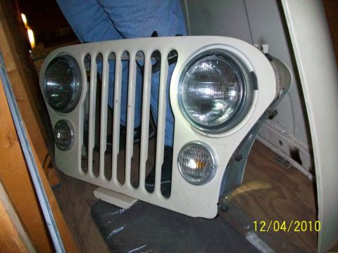1986 Jeep Wagoneer - Front grille assembly with headlights and turn signals from a Jeep CJ.