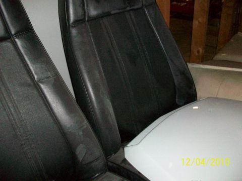 1986 Jeep Wagoneer - Interior view of black leather seats and a white console, with a date stamp visible.