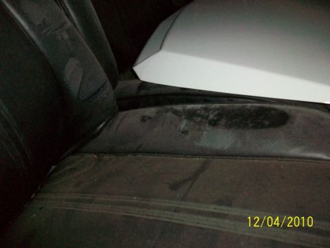 1986 Jeep Wagoneer - Interior view of car seats with an unidentified white object placed on them. Date stamp visible.