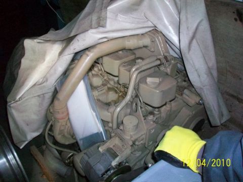 1986 Jeep Wagoneer - Engine components are partially covered by a tarp, with a date stamp of 12/04/2010 visible.