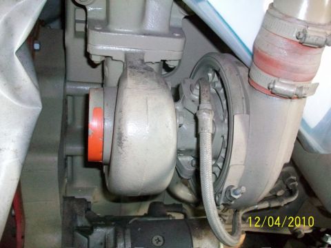 1986 Jeep Wagoneer - A close-up view of a turbocharger assembly with associated hoses and engine components is visible in this image.
